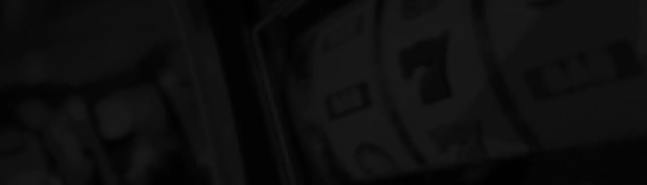 Fondo oscuro con tambores de máquina de juego usado como banda gráfica